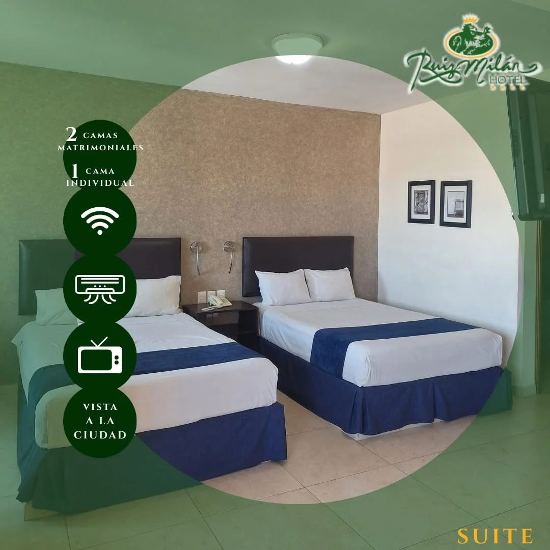 Suite de Hotel Ruiz Milán con dos camas y equipamiento